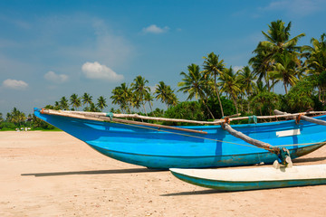 Fototapeta na wymiar Traditional fishing boat on Sri Lanka beach