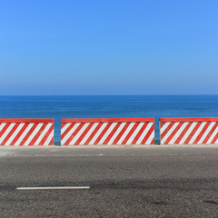 empty road -  ocean and blue sky background