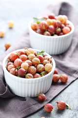 Gooseberries fruit on a grey table