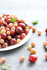 Gooseberries fruit on a grey table