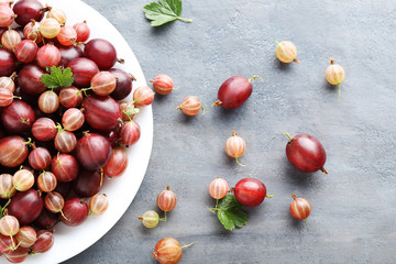 Gooseberries fruit on a grey table