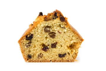 Slice of cake with raisins isolated on white background.