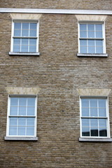 Georgian windows architecture on a wall house, London, UK