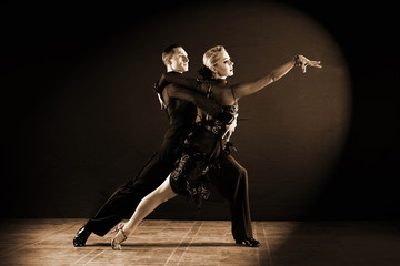 dancers in ballroom isolated on black background