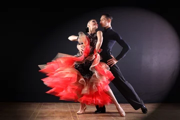 Fotobehang dancers in ballroom isolated on black background © konstantant
