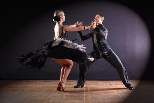 dancers in ballroom isolated on black background