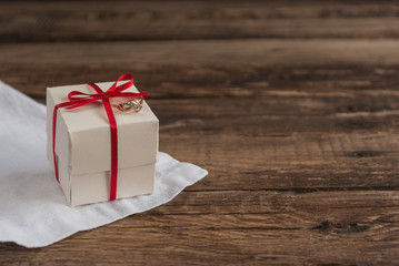 Box and Flowers on wooden table for Valentines day