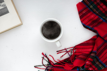 cup of black coffee on a white background,  red cloth