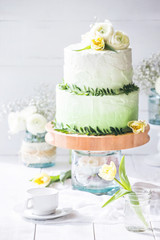 Amazing Wedding cake with decoration on white wooden table