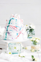 Amazing Wedding cake with decoration on white wooden table