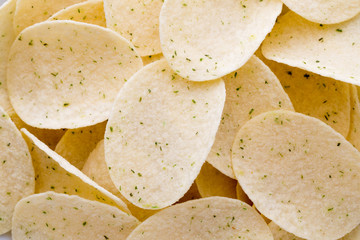 Close up potato chips on wood top view background.