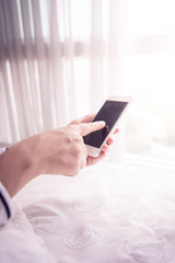 hands holding smartphone