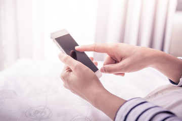 hands holding smartphone