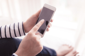 hands holding smartphone