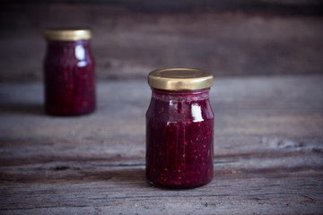 .Homemade jam with raspberry on the wooden table