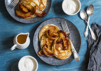 Buttermilk pancake with roasted honey cinnamon apples. Delicious Breakfast on a wooden table, top view