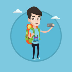 Man with backpack making selfie.