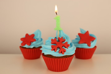 number 1 candle on red cupcake