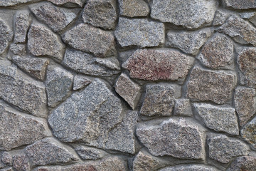 background wall built of large stones closeup