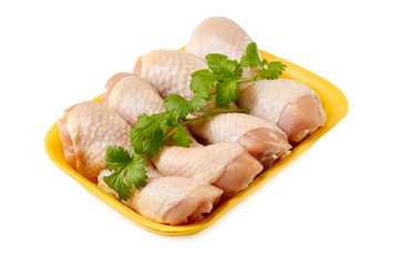 Raw chicken legs on retail tray