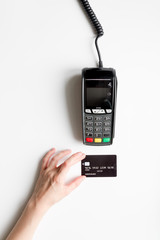 payment terminal with card on white background top view