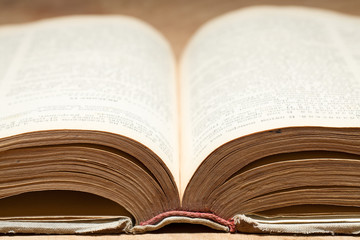 Open old book. Selective focus.