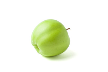 Green apple lying on its side a white background
