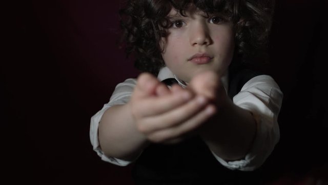 4k Shot of a Cute Businessman Child Showing his Hands (focus on boy)