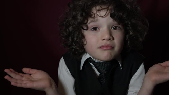 4k Shot of a Cute Businessman Child Questioning and Wondering