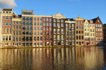 Naklejka premium View of Amsterdam with houses built on canals 