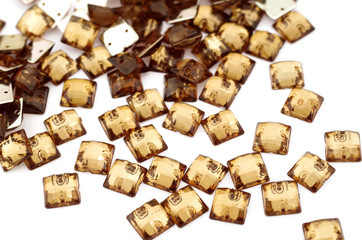 Brown rhinestone on white background