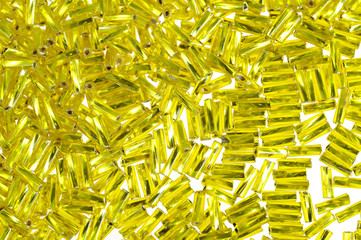 Yellow glass beads background - closeup beads texture