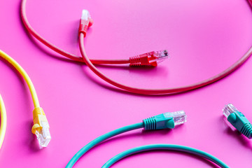 concept network internet cable on pink background close up
