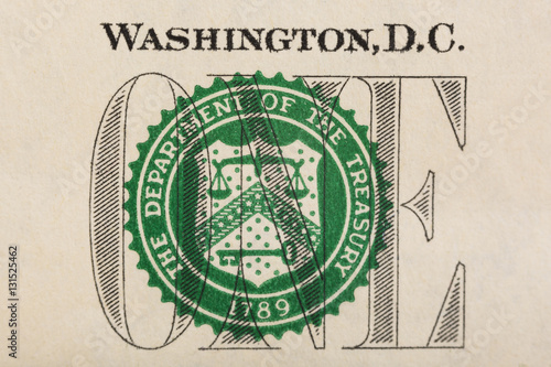“Stamp of the Department of The Treasury on US one dollar bill closeup