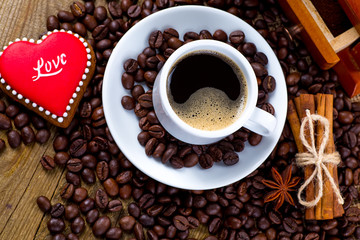 Cup of black tea and heart shaped cookies, for valentine's day