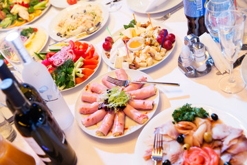 Salads and snacks on holiday table in a restaurant