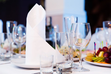 Restaurant table with glasses and napkins