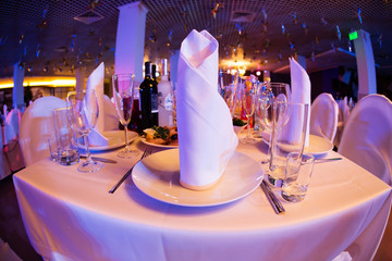 Restaurant table with glasses and napkins