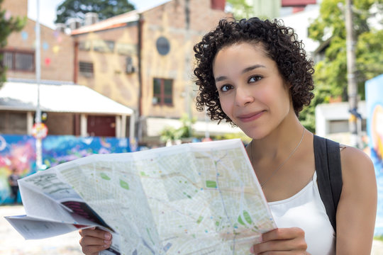 Woman With Curly Hair Holding Map