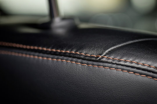 Car interior detail. Leather seat part. Macro.