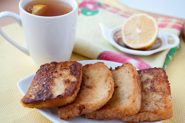 with lemon closeup fried bread and tea  