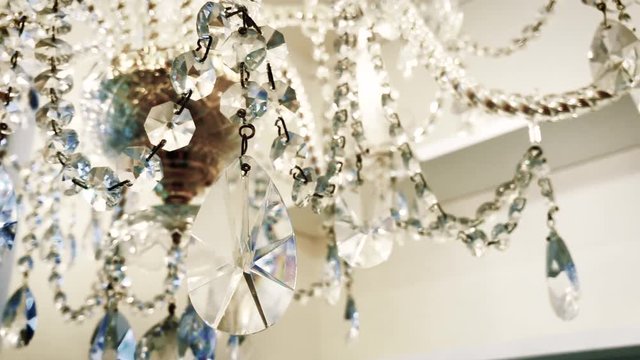 The crystal of the chandelier is shining
