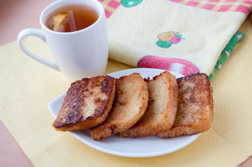 Toast and tea with lemon for breakfast  