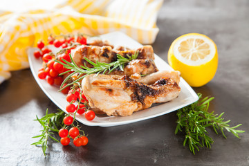 chicken legs a grill with seasonings on a table, selective focus