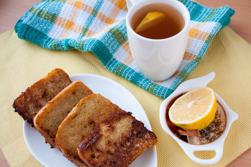 Breakfast: tea with lemon and fried bread 