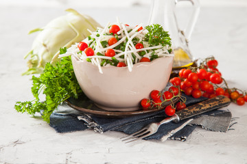 salad from a kohlrabi with green onions, selective focus