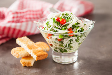 salad from a kohlrabi with green onions, selective focus