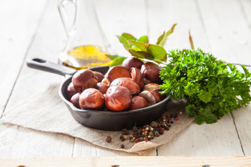 chestnuts on a table with spices, selective focus