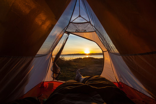 Fototapeta camping tent glow up with sunrise in morning