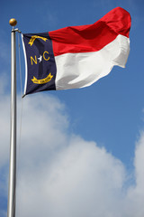 North Carolina State flag waving under sky